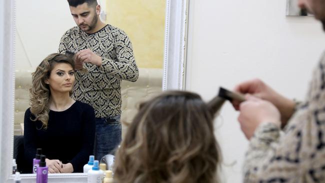 The risque presenting style has caused a stir on social media.