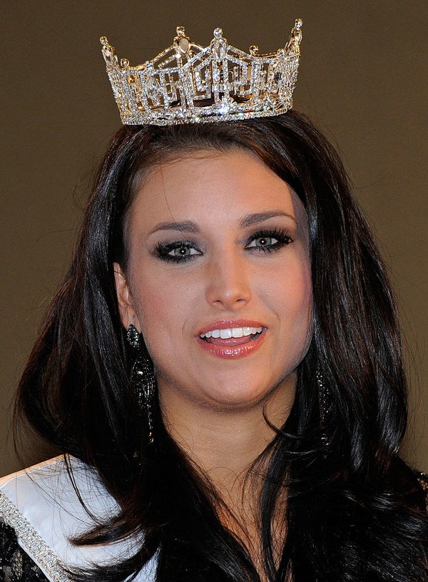 Kaeppeler smiling and wearing her crown