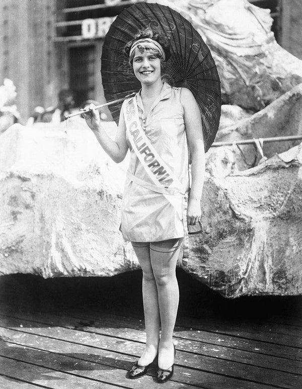 Lanphier smiling and holding an umbrella