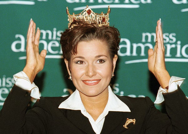 French smiling and wearing her crown