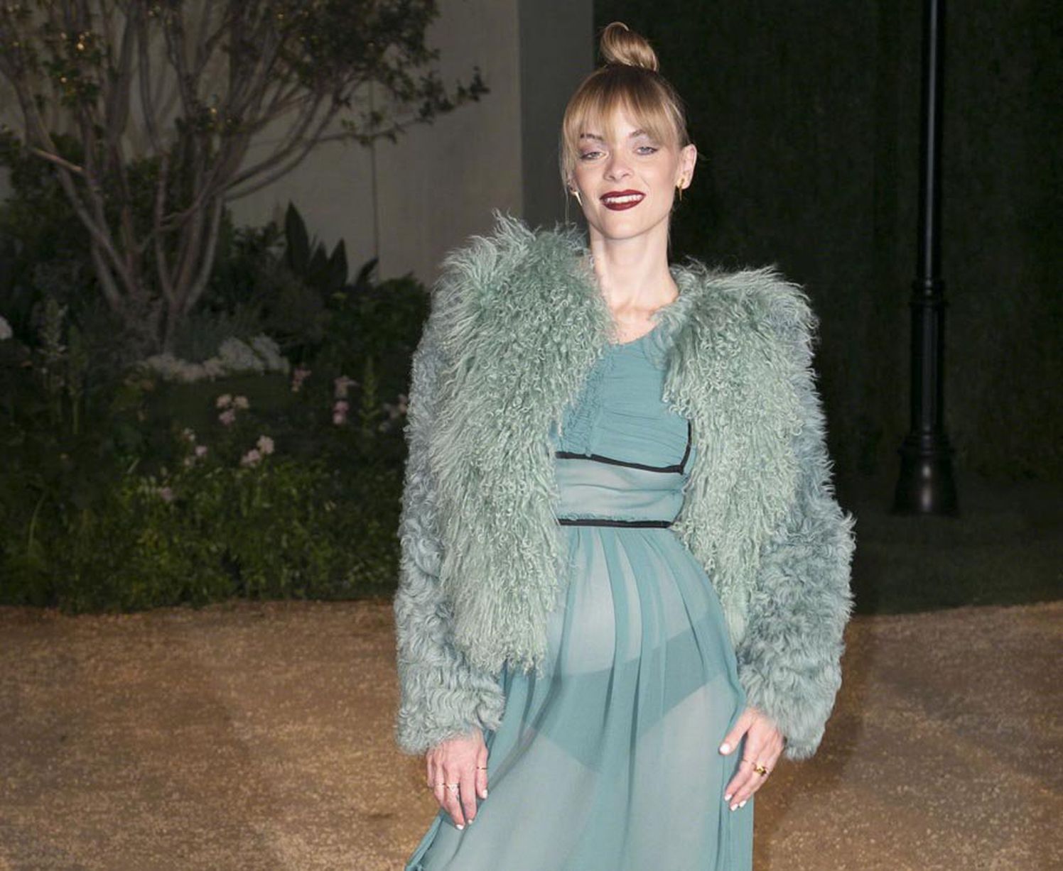 Jaime King's underwear peaks through her sheer green dress